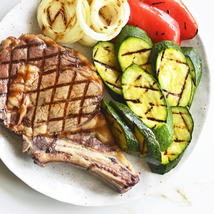 steak and grilled veggies on plate