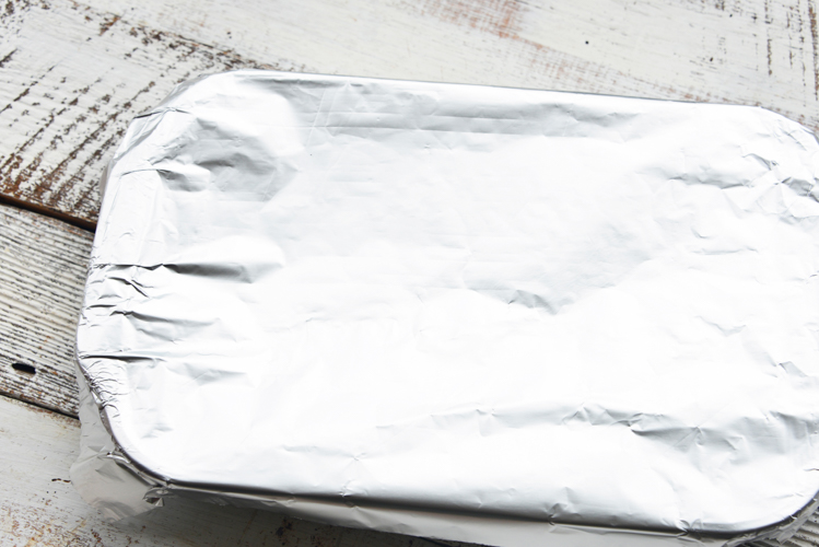 Glass baking dish cover up with aluminum foil