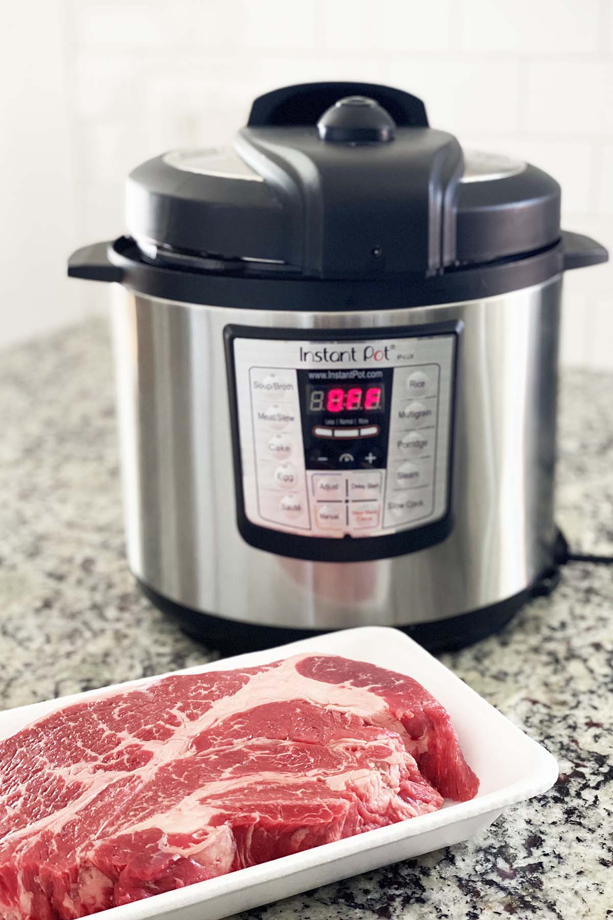 chuck roast in front of instant pot on kitchen countertop