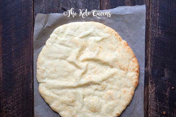 Image of a freshly cooked fat head pizza crust from above