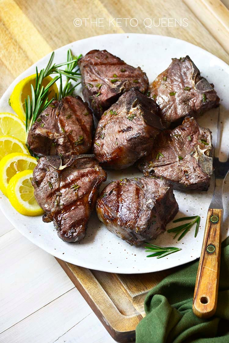grilled lamb chops on white plate