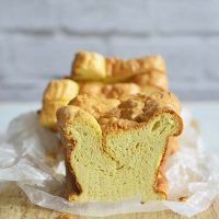 Homemade White Bread Recipe (Almost Zero Carb Bread) on Wooden Bread Board with Subway Kitchen Tile Background