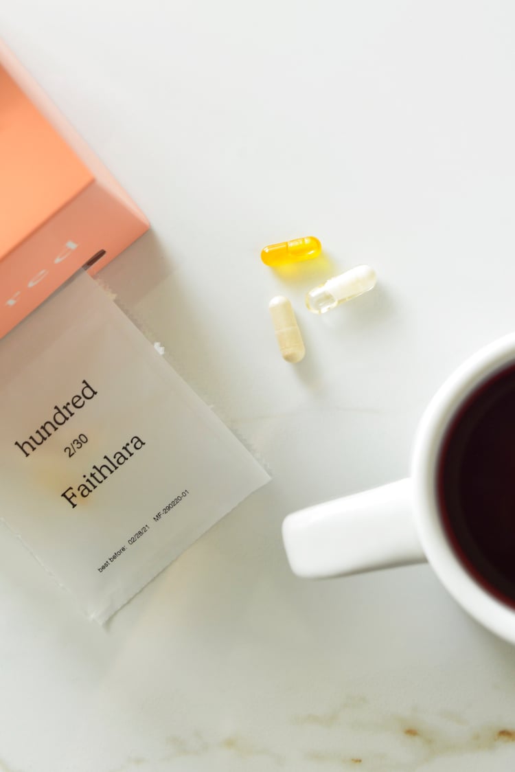 image of hundred vitamins with a cup of tea