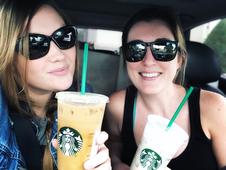 faith and lara holding starbucks drinks