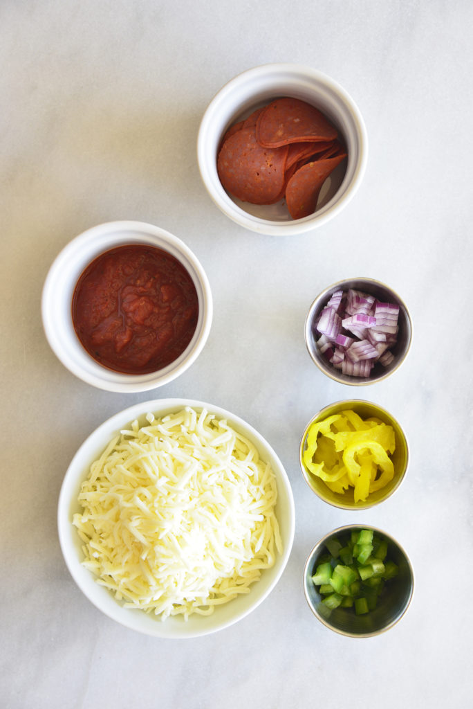 Easy Keto Pepperoni Pizza Dip individual ingredients in white bowls