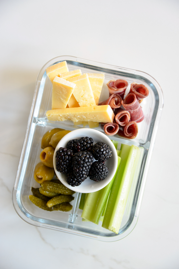 Charcuterie and cheese is a quick and easy keto meal prep idea! Pack some charcuterie meats, cheese, pickles, olives, and celery in your favorite meal prep container. It'll make for a delicious, grab and grow lunch.