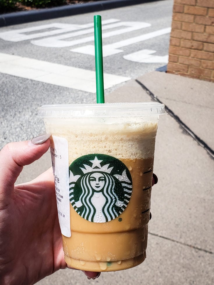 Tired of boring black coffee? Check out my top 5 Keto Starbucks Drinks to brighten your morning. image of a person holding a keto frappuccino