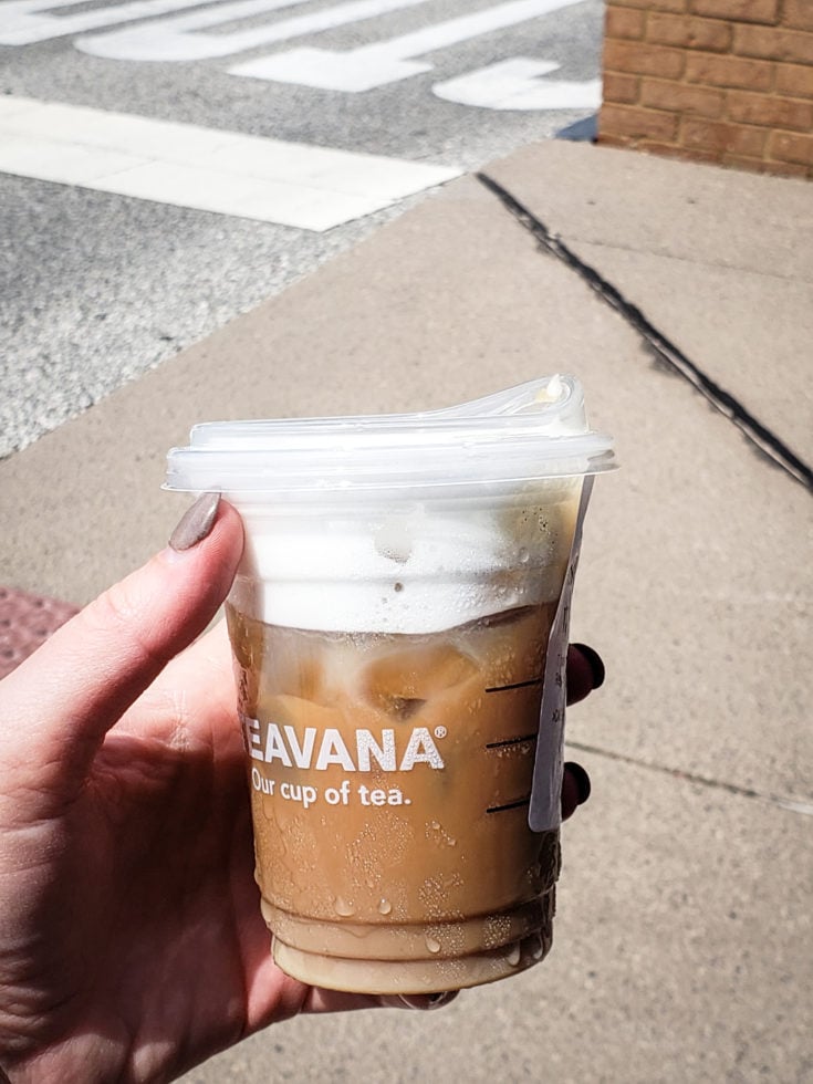 Tired of boring black coffee? Check out my top 5 Keto Starbucks Drinks to brighten your morning. image of a person holding a Iced Starbucks Blonde Cold Foam Cappuccino