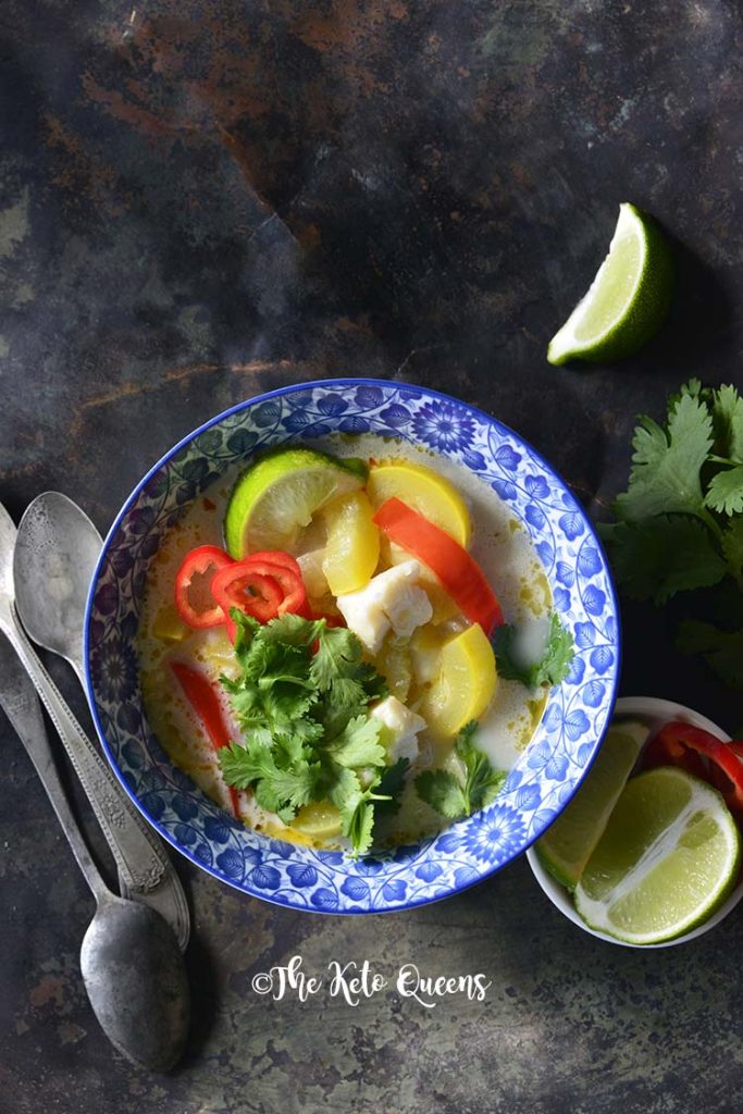 image of a bowl of thai coconut curry with red bell peppers and yellow squash.
