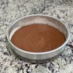 flourless cake batter in round pan