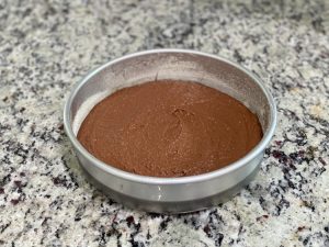 flourless cake batter in round pan