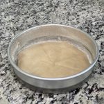 a round pan lined with parchment paper