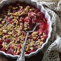 Low Carb Raspberry Crisp Recipe (Keto Fruit Dessert) on Wooden Table