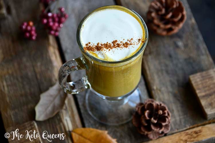 Low Carb Sugar Free Pumpkin Spice Latte with Autumnal Leaves and Pinecones