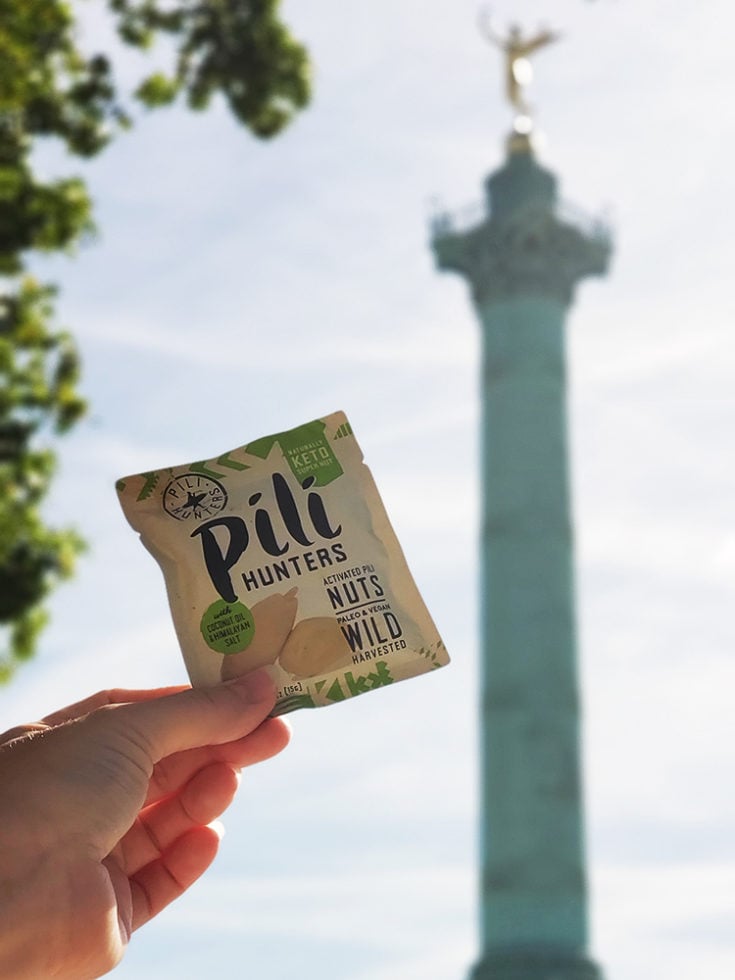 Pili hunters a keto travel snack in from of Bastille in Paris