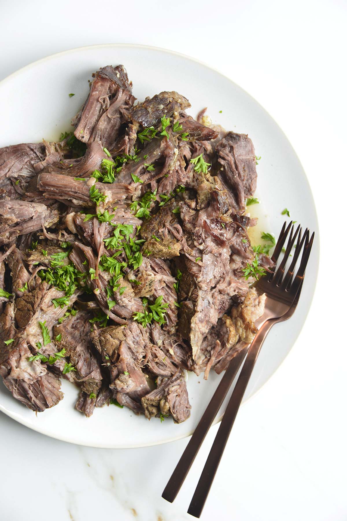 plate of shredded chuck roast made in instant pot