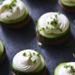 Summer Sausage Cucumber Bites with Cream Cheese Mousse and Fresh Chives on Slate Board