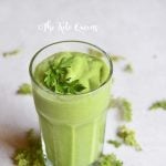 detox keto green smoothie in a clear cup with parsley on top