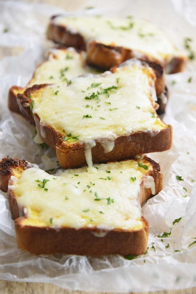 low carb Texas toast on a parchment paper topped with parsley