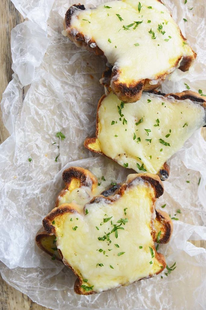 low carb Texas toast on a parchment paper topped with parsley
