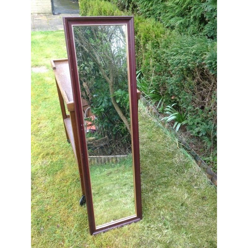 Dark wood full length mirror.