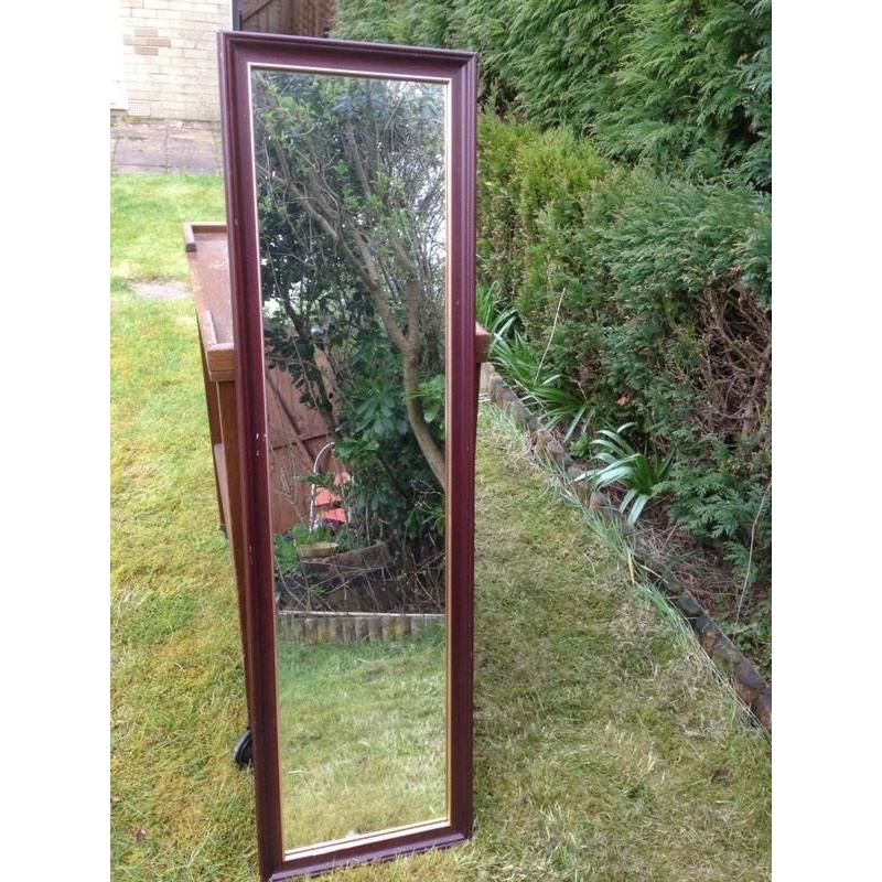 Dark wood full length mirror.