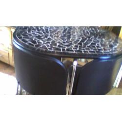 black granite table and 4 chairs in verygood condition ideal spacesaver