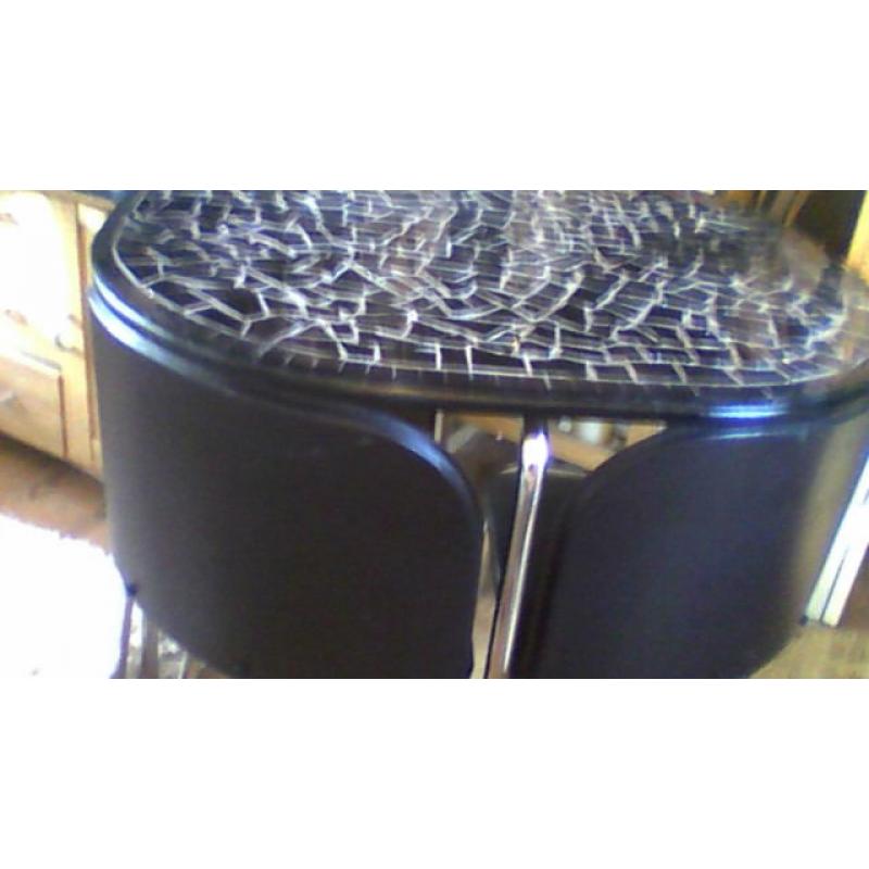 black granite table and 4 chairs in verygood condition ideal spacesaver