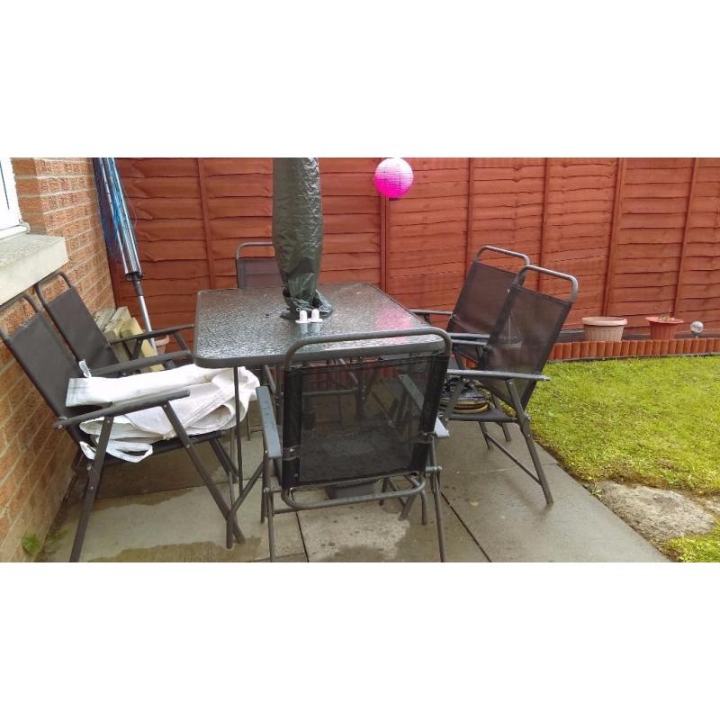 Glass garden table and 6 chairs