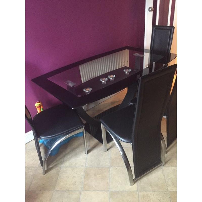 Glass dinning table with 4 chairs